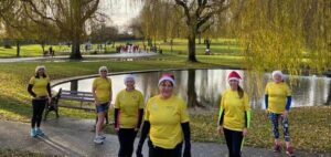 Sharon Johnson and team members of #WMPMND at Sanders Park, Bromsgrove taking part in Primrose Hospice's Santa Fun Run