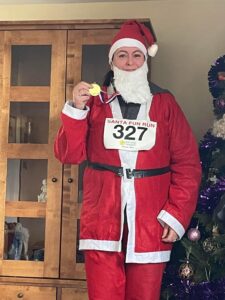 Joanna Painter dressed as Santa after completing Santa Fun Run